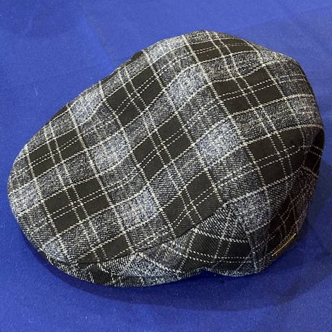 Duckbill hat with a grey and black checker pattern